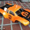 "MOPAR" truck body. I love orange, so this body was especially cool to me. This racer asked me to do the Mopar scheme and the Super Bee logo on the side. Thanks to Rockstar Paint for help with the super-detailed Super Bee masks! Really sets off the body. 
