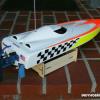 Aquacraft Supervee 27.  Stock white fiberglass hull with custom graphics applied.
