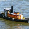 Midwest Products "Liberty Tug" built from kit and painted in harbor colors.  Also weathered appropriately.