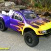 This is an Associated SC10 with a Pro-Line Raptor F150 SVT body on it.  This body will fit many short course trucks, but it was made for the SC10.  Paint is metallic purple and black, various neon colors for the flames.  