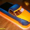 Nastruck body for oval racing.  Neon orange Faskolor and blue.  Racer asked that I not cut out the body for him to insure it fit his chassis precisely.  Faux Carbon fiber on rear deck.