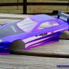 Honda Prelude body by HPI.  I really like the way this body handles on the racetrack.  Done similar to the orange one elsewhere on this page, but this time with metallic purple and neon purple.