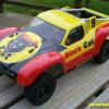 This is a Parma Rattler body made specifically for the Traxxas Slash.  The "BLACK CAT" fireworks theme was my son's idea.  The logo was done with a carefully cut paint mask.  The finished result is all paint!  Looks great we both think.  Too nice to run on the track though!