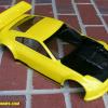 Nissan 350Z body by HPI.  Done in Faskolor yellow and black with a faux carbon fiber look on the hood.  