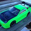 This is a Tamiya Mazda RX-7.  Faskolor neon green!  Faux carbon fiber hood.  I like how the headlights turned out too.  
