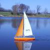 Is is one of my Victor V-32 sailboats.  Its on Avon Town Park Lake on one of those days with crystal blue skies. 