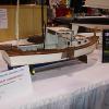 My lobsterboat at the Toledo R/C Show in 2006.  I used doll house minatures for detailing.  Same 1" = 1'-0" scale.  There's a Playboy on the dashboard and a pipe with Ohio Blue Tip Matches.  12-pack of Old Milwaukee too!  The boat is equipped with RAM lights for night running.