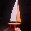 This is a micro model of the Victor V32 Sailboat.  I made it for a Christmas Tree decoration.  Balsa Hull and paper sails.  Fishing line stays.
