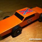 "The General Lee" was inspired by the Dukes of Hazzard TV show of course.  Something tells me there have been MANY General Lee Pinewood Derby cars!